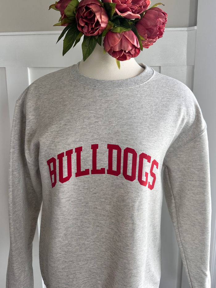 Oatmeal sweatshirt with 'BULLDOGS' printed on it